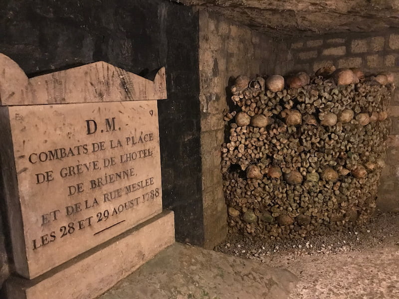 Paris, France catacombs: skulls and stone markers Paris, France catacombs: skulls and stone markers