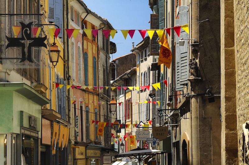 Streets of Apt in the Luberon, with cheerful flags flying