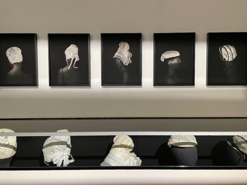 Collection of bonnets on display at Normandy Museum in Caen Castle
