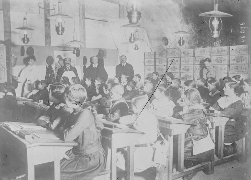 Old champagne caves in France during World War I - children studying