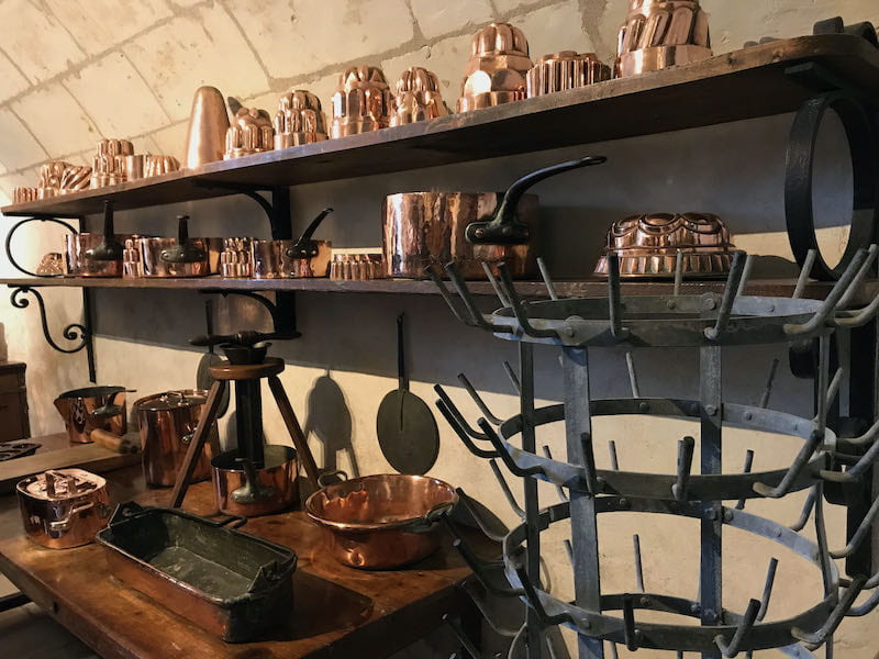 Copper molds on shelves at Chenonceau kitchens