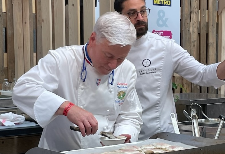 Chef Christian Tetedoie prepares food at the Lyon Street Food Festival Chef Christian Tetedoie prepares food at the Lyon Street Food Festival