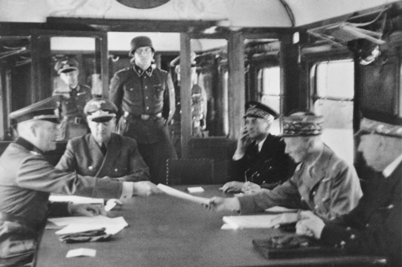 German and French officers signing 1940 armistice in Compiegne railway wagon