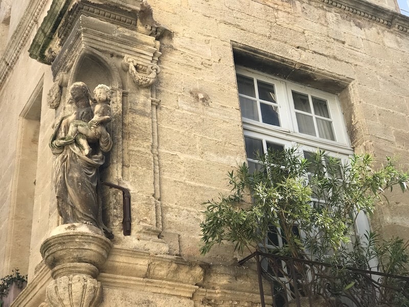 Statue on a building in Cucuron, Luberon Statue on a building in Cucuron, Luberon