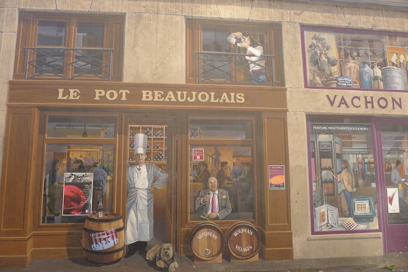 One of Lyon's many outdoor murals - decpicts a restaurant facade, called Le Pot Beaujolais, and a chef standing outside