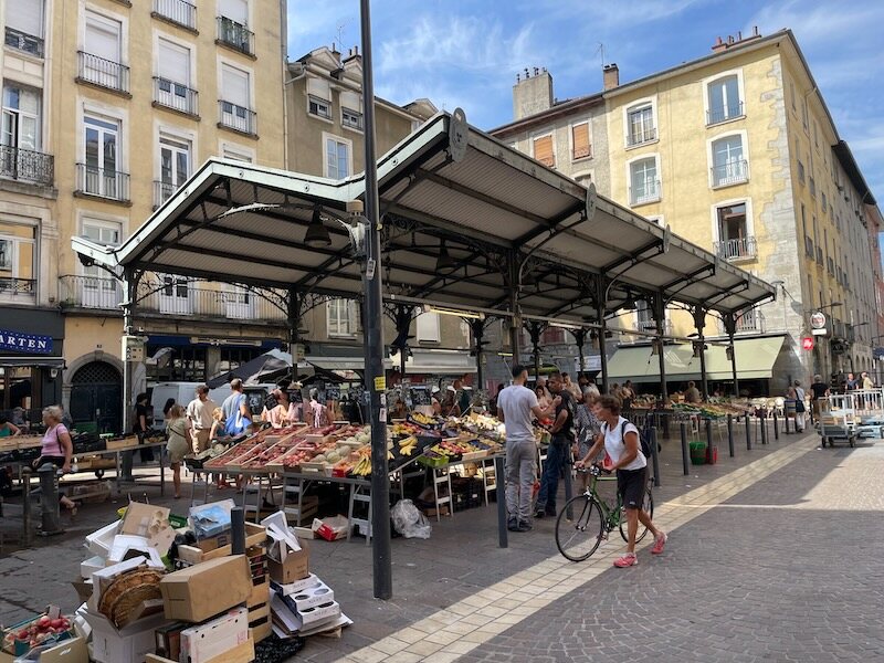 Morning crowds at the marketplace in Grenoble’s old town Morning crowds at the marketplace in Grenoble’s old town