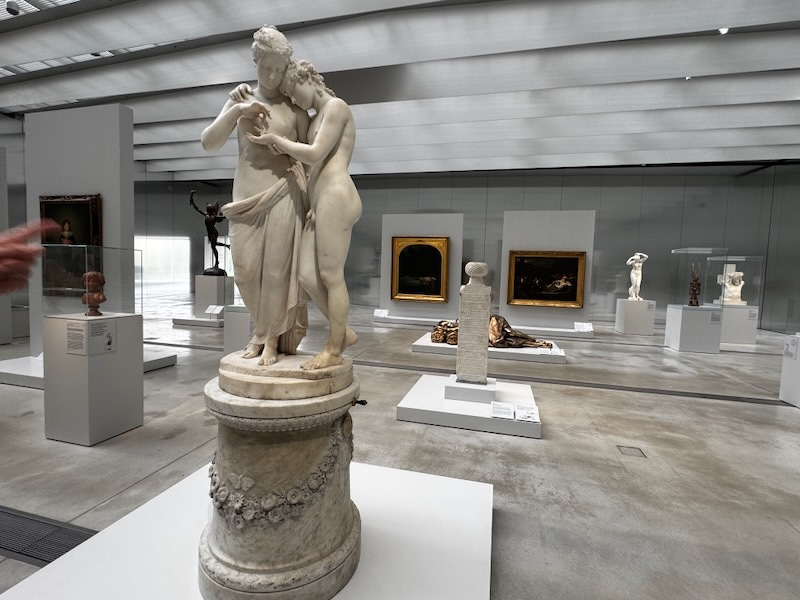 Canova marble sculpture of Cupid and Psyche embracing, with Psyche reaching toward Cupid’s face