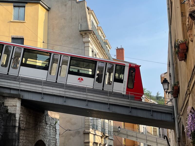 Among the best Lyon (France) things to do is to take the funicular to Fourviere, seen here from the exterior as it descends
