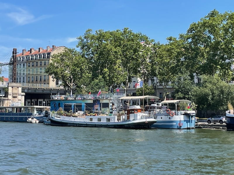 Houseboats along the Saône River in Lyon, France