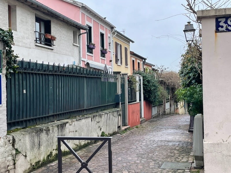District of Mouzaia in Paris, with colorful houses and cobblestones District of Mouzaia in Paris, with colorful houses and cobblestones
