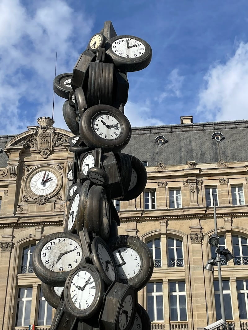 Clock statue outside St Lazare station in Paris