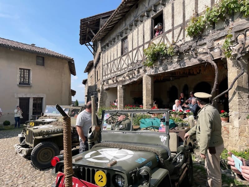 Gathering of WWII jeeps in central square of Perouges