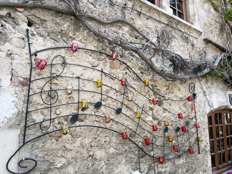 Musical notes on a wall in medieval Perouges
