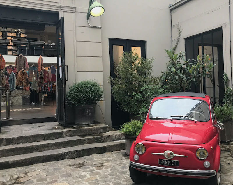red car in the marais - one of the iconic sights of paris for photographers red car in the marais - one of the iconic sights of paris for photographers