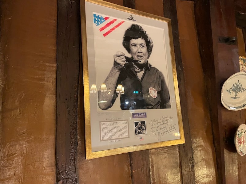 Photo of Julia Child in La Couronne Restaurant, where she had what she called the best meal of her life.