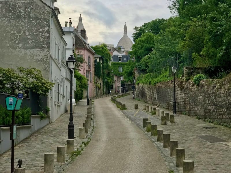 Street in Montmartre with Sacre-Coeur in the background Street in Montmartre with Sacre-Coeur in the background
