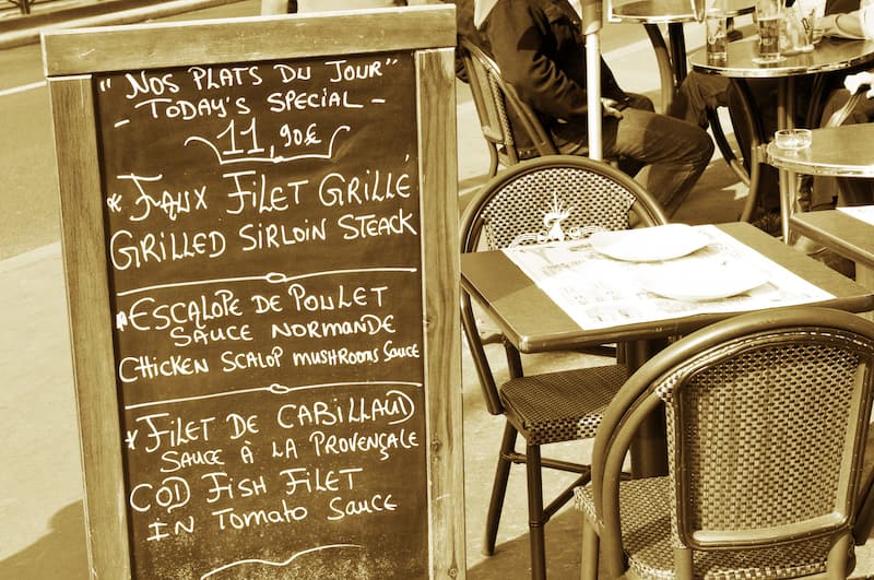 Daily menu on a chalkboard in a French cafe Daily menu on a chalkboard in a French cafe